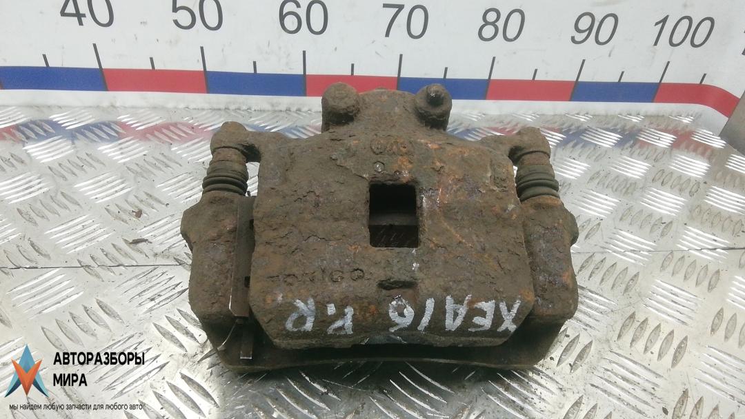 суппорт передний правый Mitsubishi L200 4 поколение 2006, 2.5 л., дизель, МКПП, пикап - фото №1