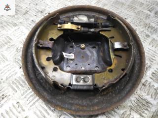 Механизм развода задних тормозных колодок левый Ford Fiesta 5 поколение 2003, 1.3 л., бензин, МКПП, серый, хетчбэк 5 дв.