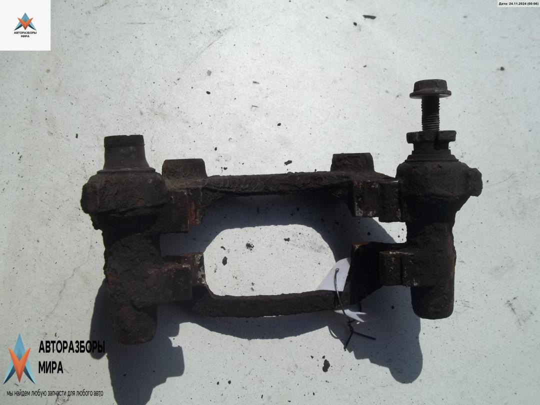 скоба суппорта Opel Astra G 2000, 1.6 л., бензин, МКПП, серый, хетчбэк 5 дв. - фото №1