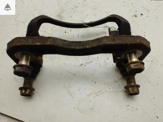 скоба суппорта Mazda Xedos 9 1 поколение [2-й рестайлинг] 2000, 2.0 л., бензин, МКПП, серый, седан