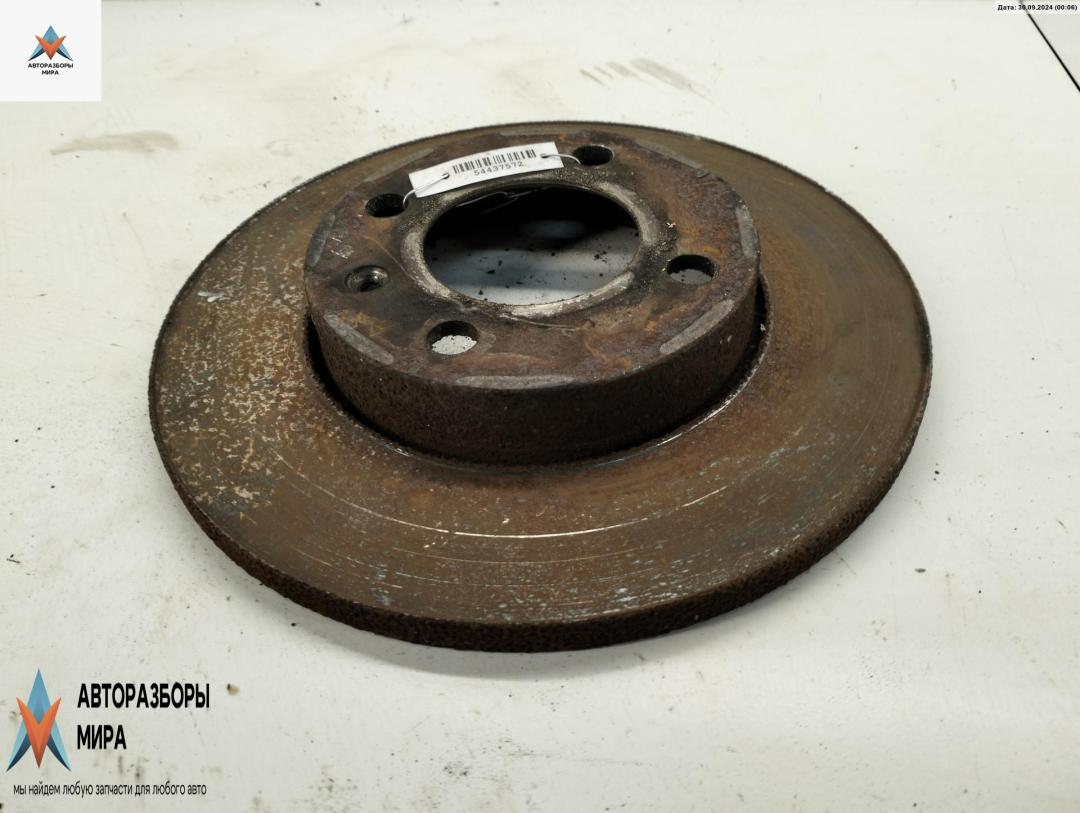 диск тормозной передний Volkswagen Golf 3 поколение 1992, 1.4 л., бензин, МКПП, белый, хетчбэк 3 дв. - фото №1