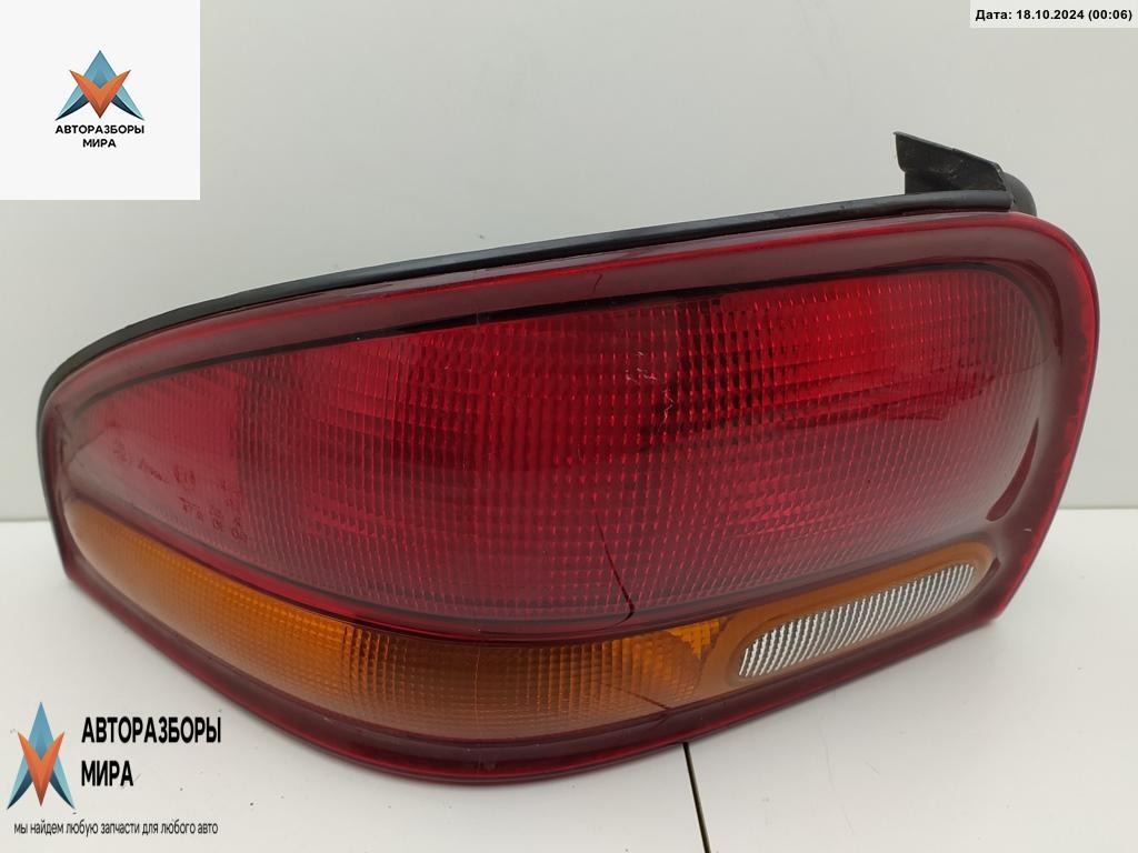 фонарь задний левый Chrysler Stratus 1 поколение 1998, 2.0 л., бензин, АКПП, чёрный, седан - фото №1