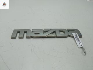 эмблема Mazda Tribute 1 поколение 2001, 2.0 л., бензин, МКПП, серый, внедорожник 5 дв.