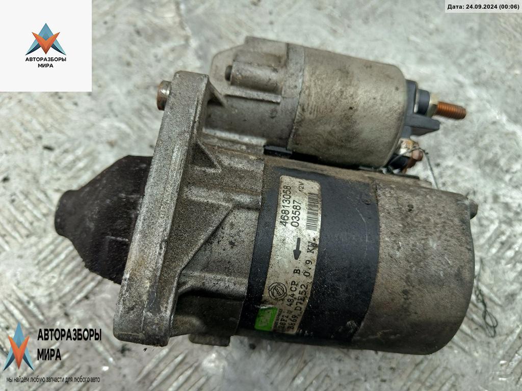 стартер Fiat Stilo 1 поколение 2002, 1.2 л., бензин, МКПП, чёрный, хетчбэк 3 дв. - фото №1