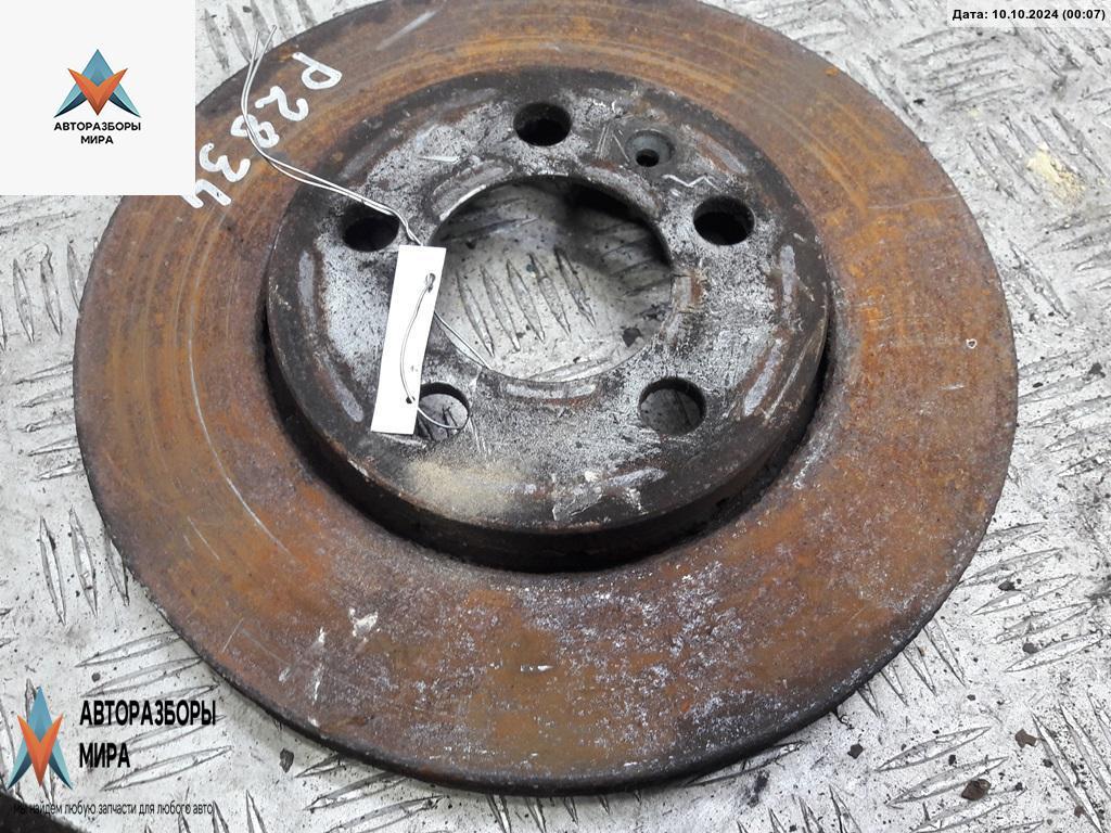 диск тормозной передний Volkswagen Golf 4 поколение 1999, 1.4 л., бензин, МКПП, зелёный, хетчбэк 5 дв. - фото №1