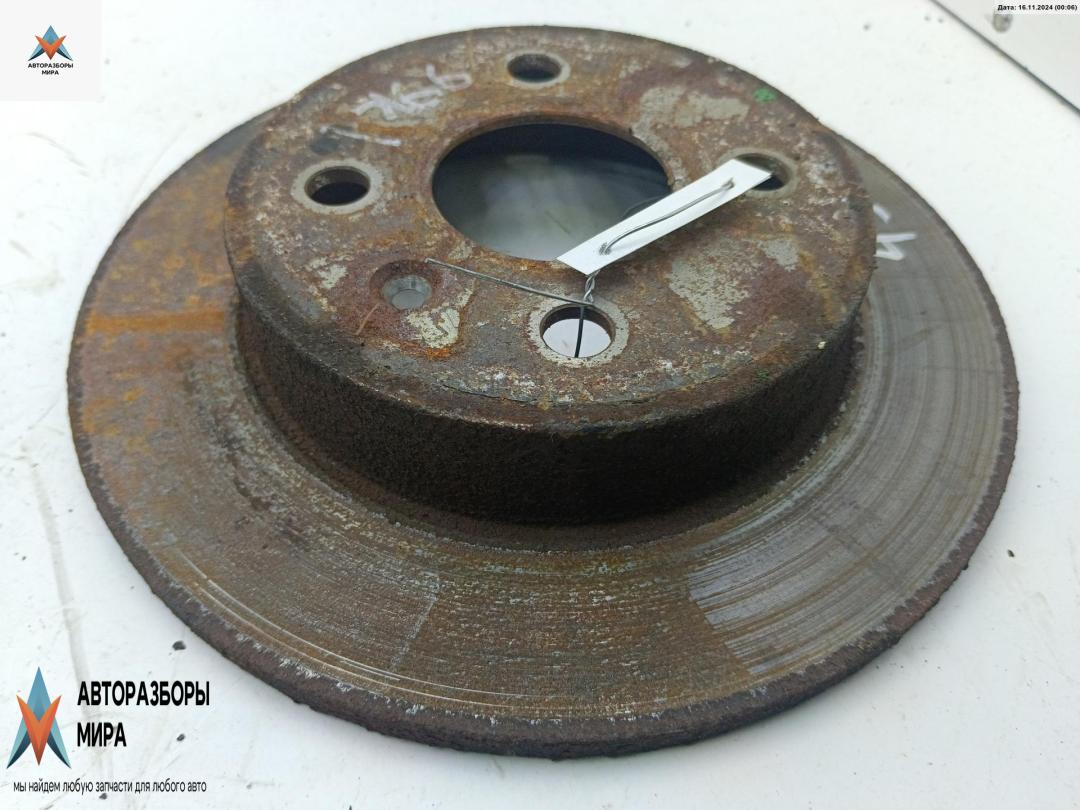 диск тормозной задний Opel Astra G 1999, 1.6 л., бензин, МКПП, зелёный, хетчбэк 5 дв. - фото №1