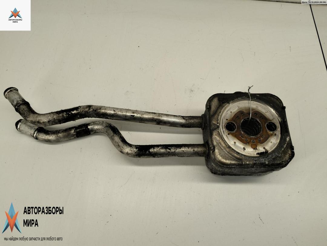 теплообменник масляного фильтра Volkswagen Golf 4 поколение 2000, 1.4 л., бензин, МКПП, белый, хетчбэк 3 дв. - фото №1