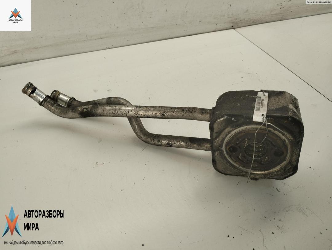 теплообменник масляного фильтра Volkswagen Golf 4 поколение 2000, 1.6 л., бензин, МКПП, чёрный, хетчбэк 5 дв. - фото №1