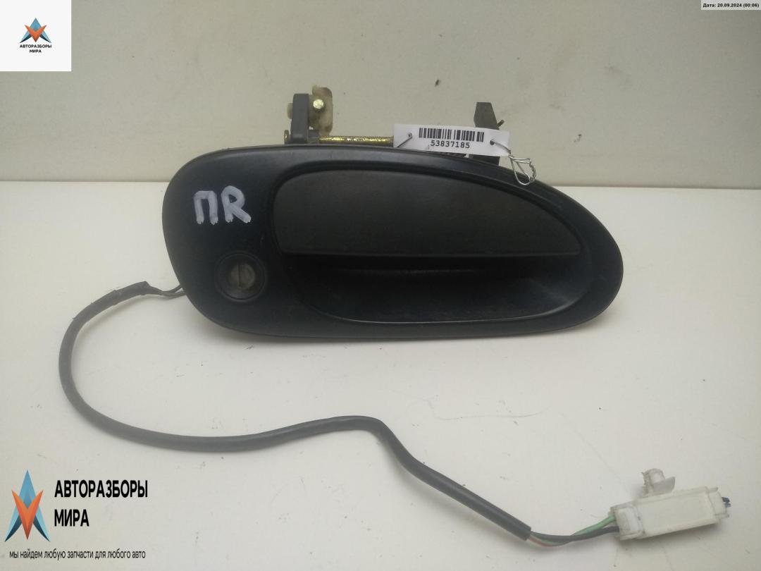 ручка наружная передняя правая Mazda 323C BA 1996, 1.5 л., бензин, МКПП, серый, хетчбэк 3 дв. - фото №1