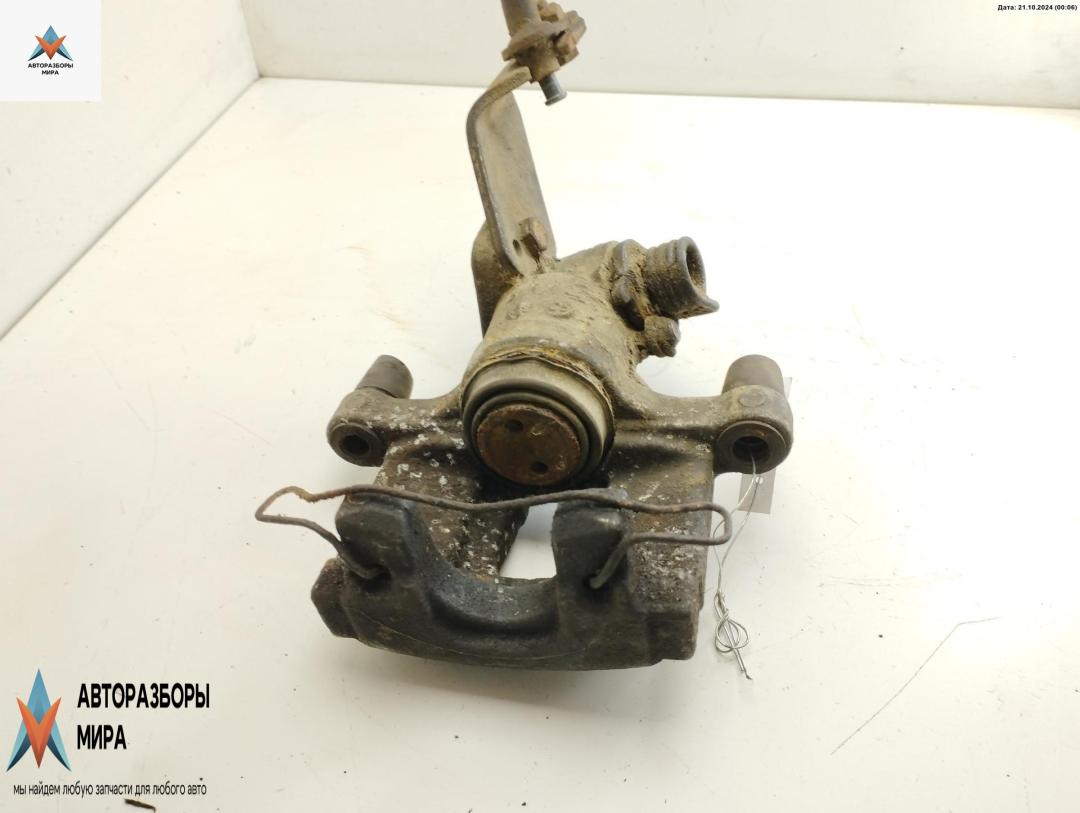 суппорт задний левый Nissan Primera P12 2002, 1.8 л., бензин, МКПП, зелёный, универсал - фото №1