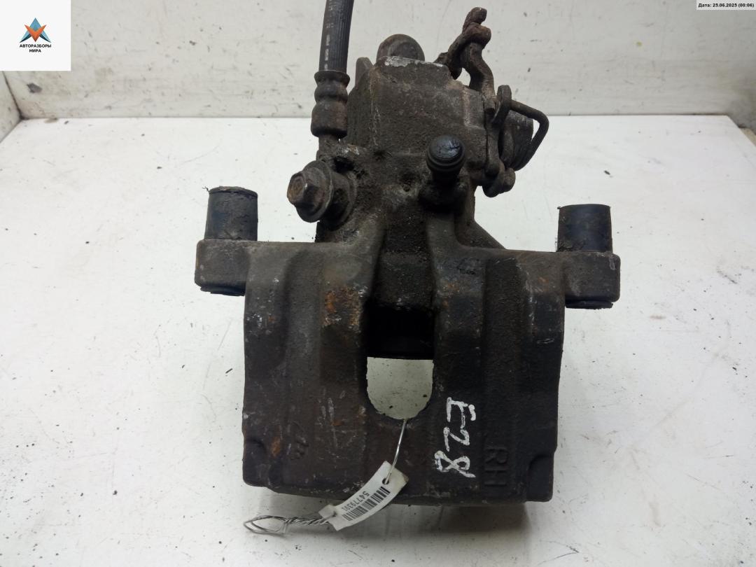 суппорт задний правый Nissan Primera P12 2003, 1.8 л., бензин, МКПП, синий, хетчбэк 5 дв. - фото №1