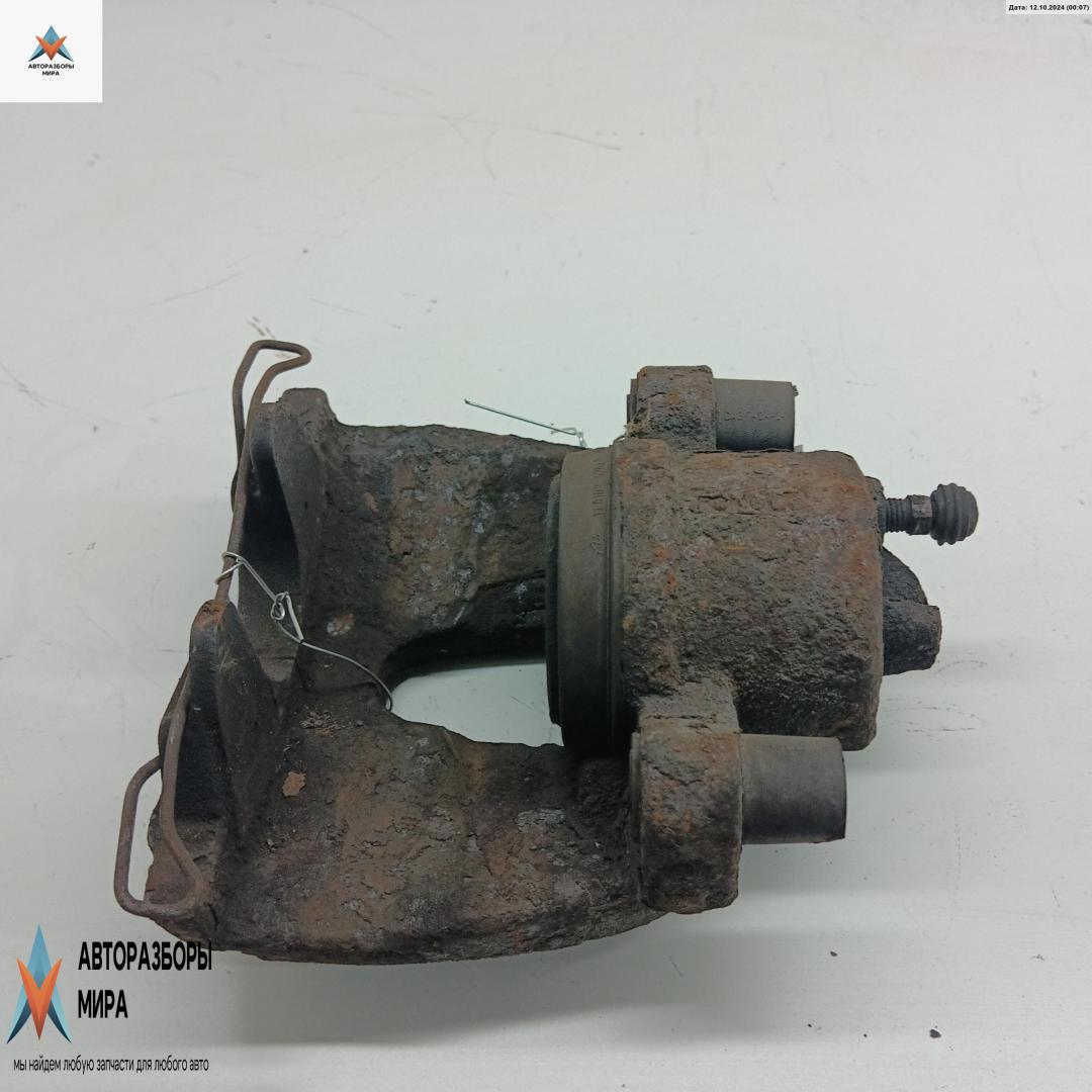 суппорт передний левый Ford Focus 2 поколение 2004, 1.6 л., i, бензин, МКПП, серый, хетчбэк 3 дв., 302 - фото №1