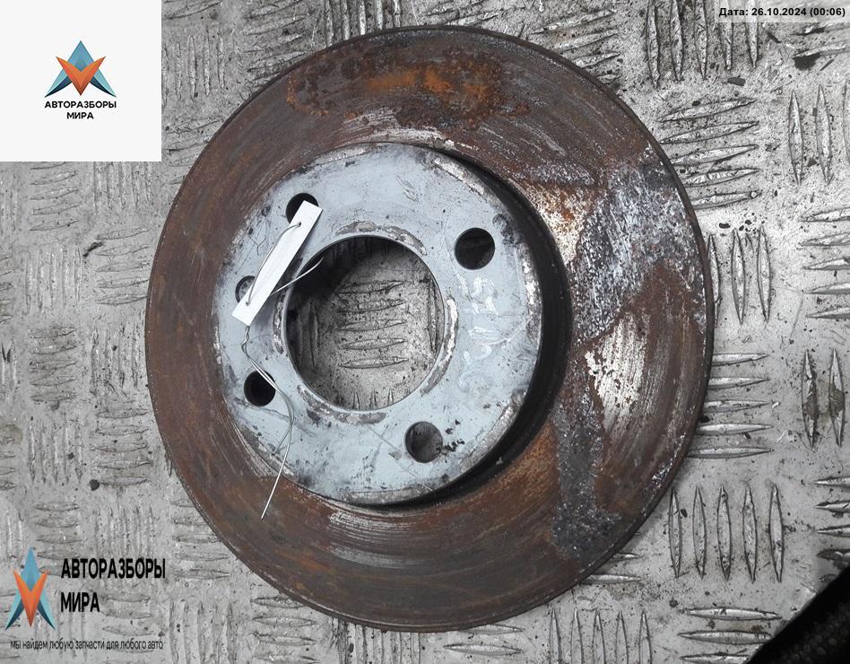 диск тормозной передний Volkswagen Golf 3 поколение 1995, 1.6 л., бензин, МКПП, красный, хетчбэк 3 дв. - фото №1