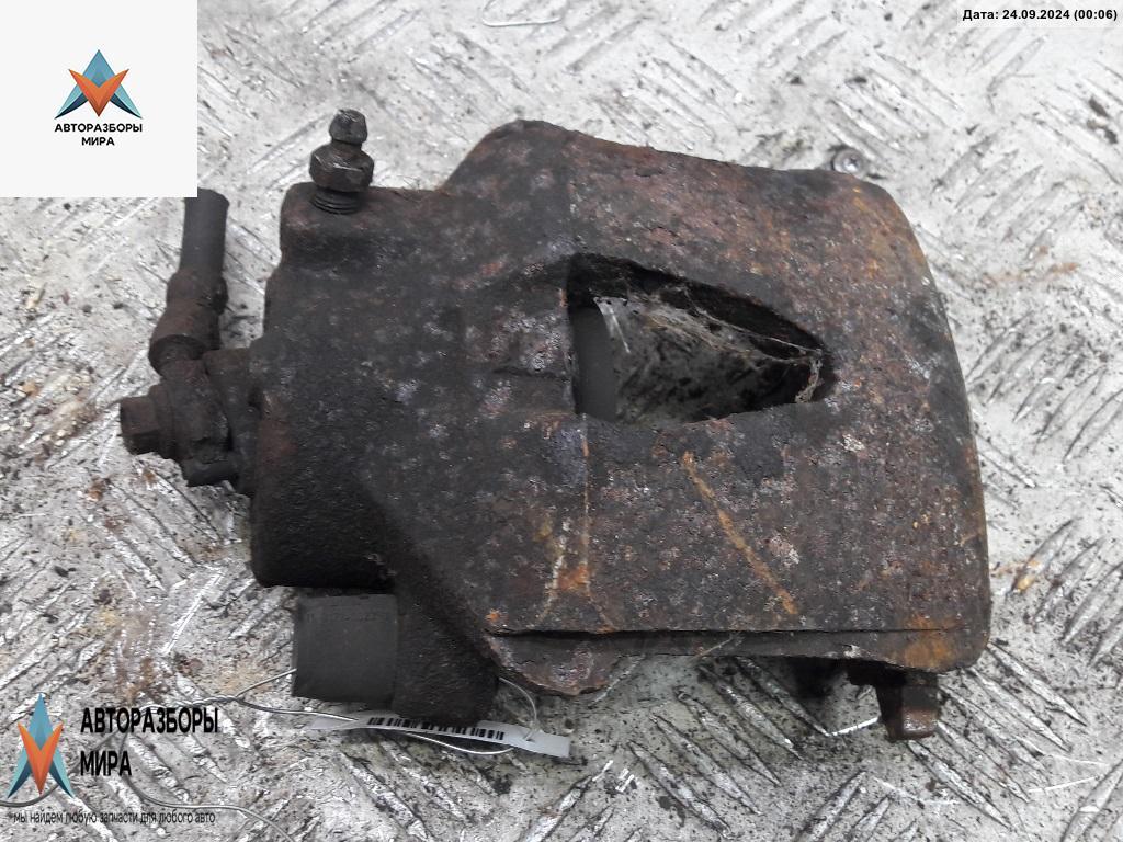 суппорт передний левый Volkswagen Golf 4 поколение 1999, 1.4 л., бензин, МКПП, зелёный, хетчбэк 5 дв. - фото №1