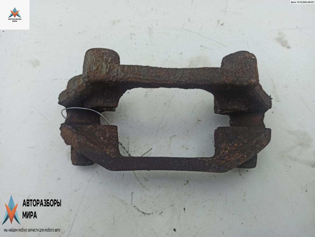 скоба суппорта Opel Zafira 1 поколение (A) 1999, 1.8 л., бензин, АКПП, серый, минивэн, BOSCH - фото №1