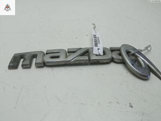 эмблема Mazda 6 GG 2004, 2.3 л., бензин, МКПП, чёрный, универсал, GJ6A51711