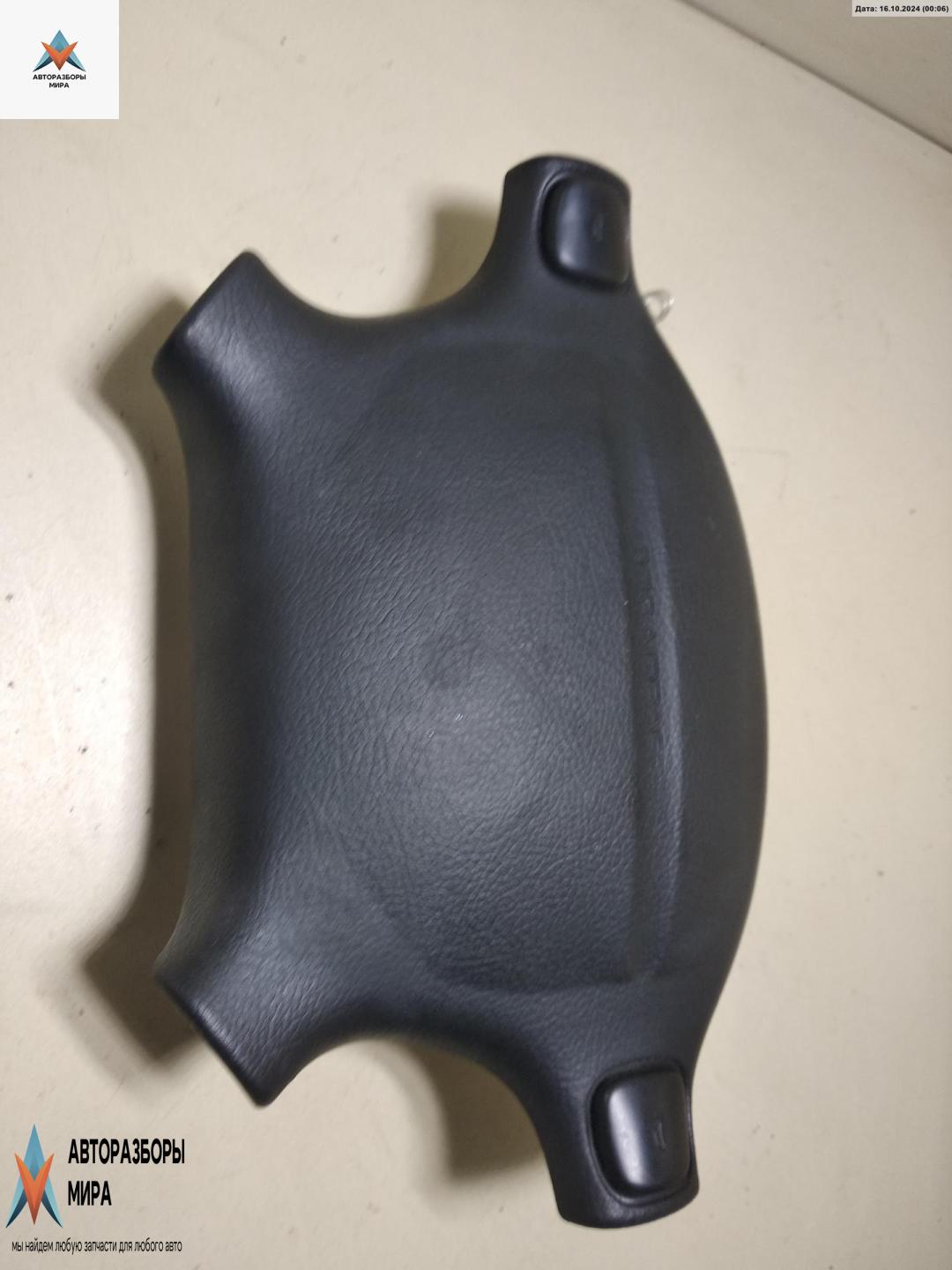 подушка безопасности водителя Mazda 323C BA 1996, 1.5 л., бензин, МКПП, серый, хетчбэк 3 дв. - фото №1