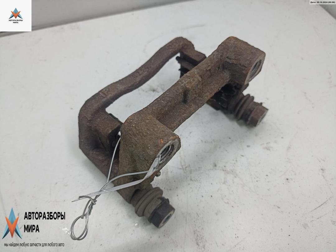 скоба суппорта Opel Astra G 2001, 1.2 л., бензин, МКПП, синий, хетчбэк 5 дв. - фото №1