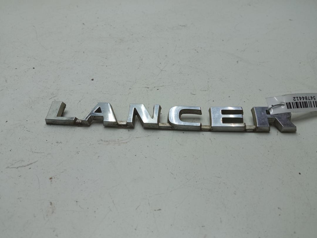 эмблема Mitsubishi Lancer 2003, 1.6 л., бензин, МКПП, серый, универсал, MN154915