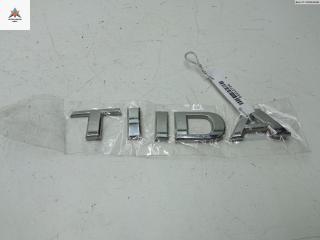 эмблема Nissan Tiida C11 [рестайлинг] 2007, 1.6 л., бензин, МКПП, синий, хетчбэк 5 дв.