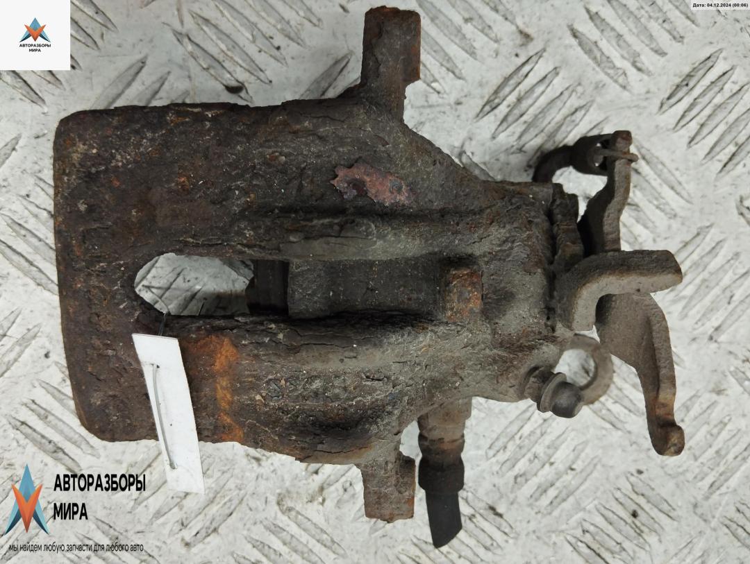 суппорт задний правый Ford Focus 1 поколение 1999, 1.8 л., бензин, МКПП, синий, универсал - фото №1