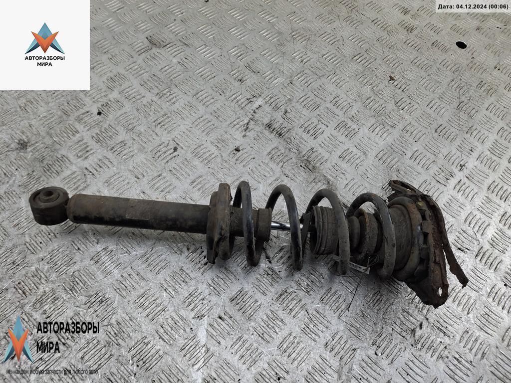 стойка передняя Nissan Almera Tino V10 2001, 1.8 л., бензин, МКПП, серый, минивэн - фото №1