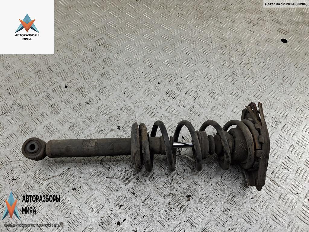 стойка передняя Nissan Almera Tino V10 2001, 1.8 л., бензин, МКПП, серый, минивэн - фото №1