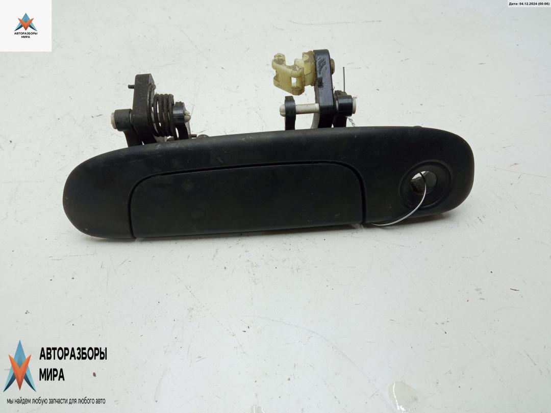 ручка наружная передняя левая Mazda 323 BJ 1999, 1.5 л., бензин, МКПП, зелёный, хетчбэк 5 дв. - фото №1