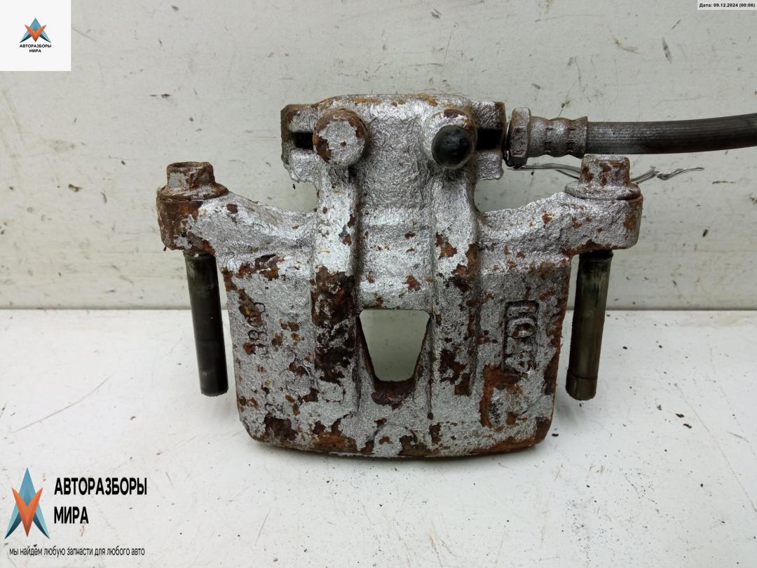 суппорт задний правый Mitsubishi Grandis 1 поколение 2004, 2.4 л., бензин, МКПП, чёрный, минивэн - фото №1