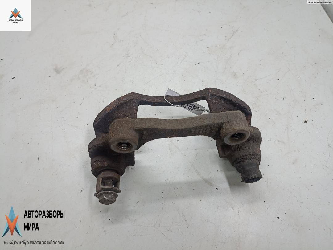 скоба суппорта Opel Zafira 1 поколение (A) 1999, 1.8 л., бензин, МКПП, серый, минивэн - фото №1