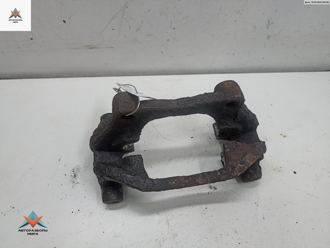 скоба суппорта Opel Astra G 2001, 2.0 л., дизель, МКПП, серый, универсал - фото №1