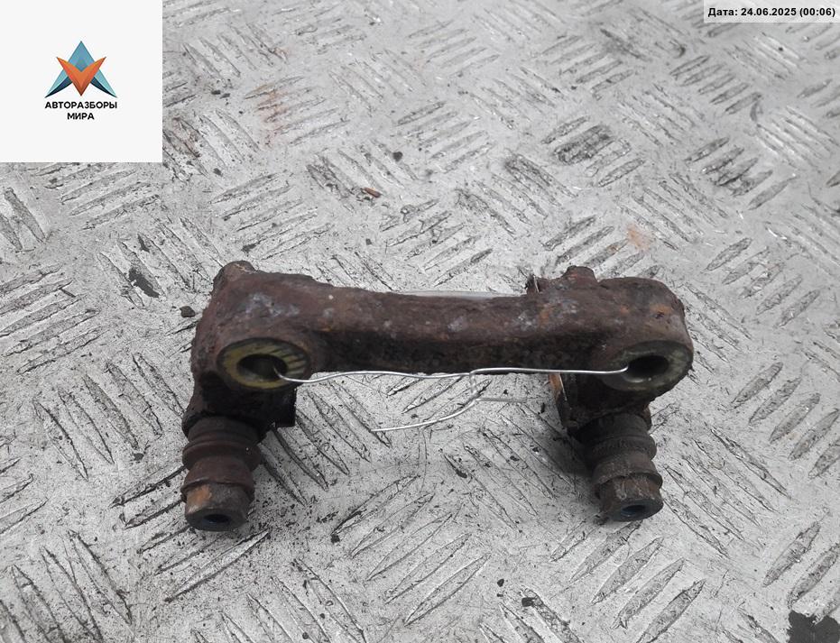 скоба суппорта Volkswagen Golf 4 поколение 1999, 1.4 л., бензин, МКПП, красный, хетчбэк 5 дв. - фото №1