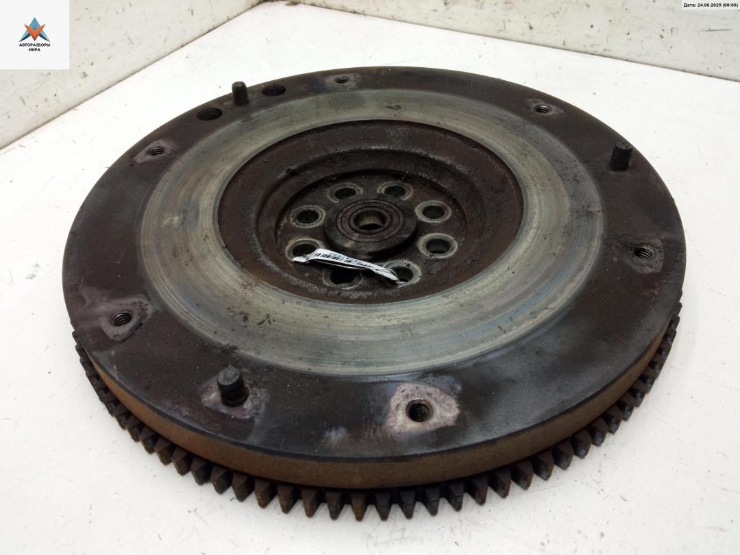 маховик Suzuki Liana 1 поколение 2003, 1.6 л., бензин, МКПП, серый, хетчбэк 5 дв. - фото №1