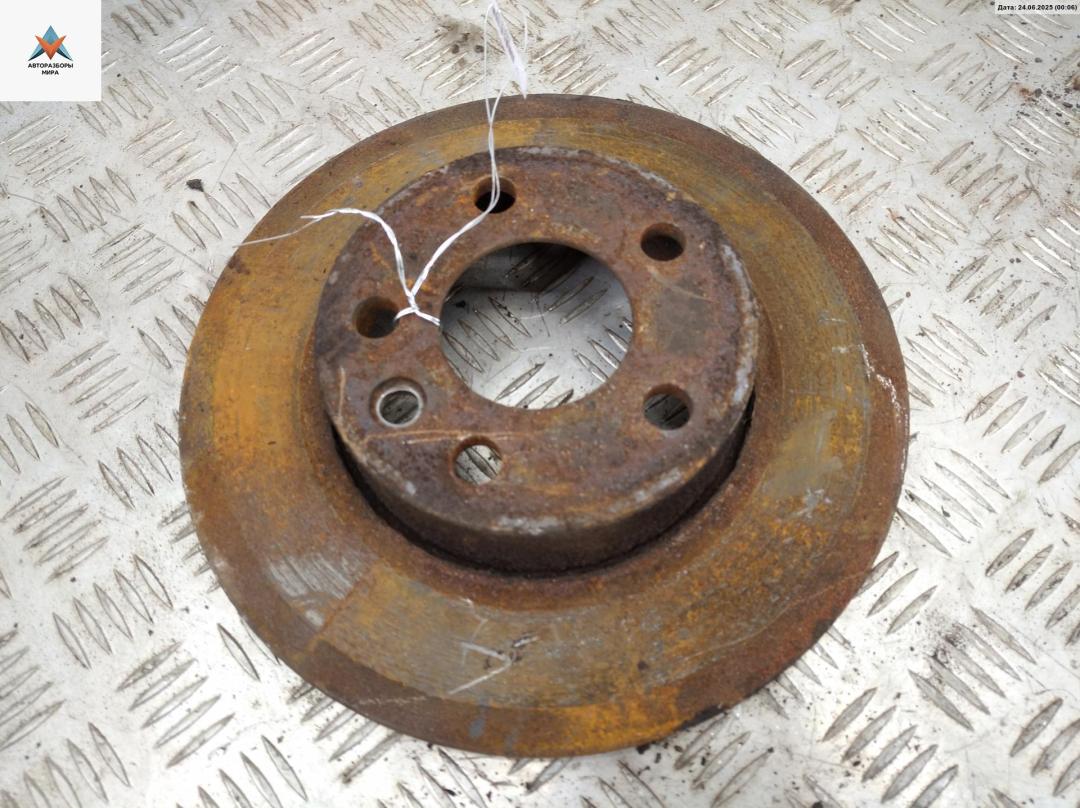 диск тормозной передний Volkswagen Transporter T4 1997, 2.4 л., дизель, МКПП, зелёный, микроавтобус - фото №1