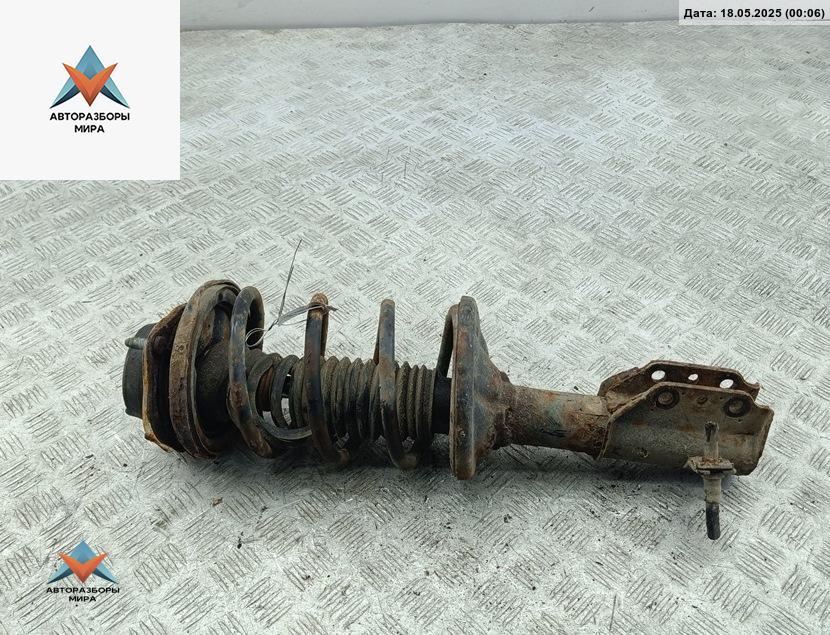 стойка передняя Mazda 323 BA 1997, 1.5 л., бензин, МКПП, синий, хетчбэк 5 дв. - фото №1