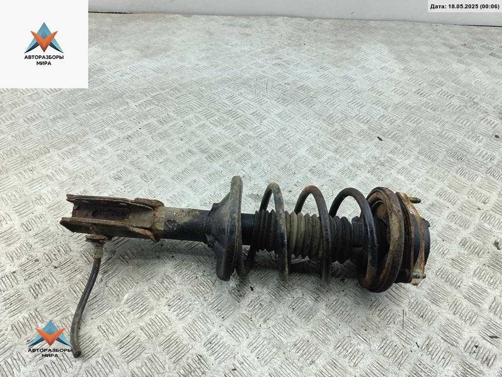 стойка передняя Mazda 323 BA 1997, 1.5 л., бензин, МКПП, синий, хетчбэк 5 дв. - фото №1