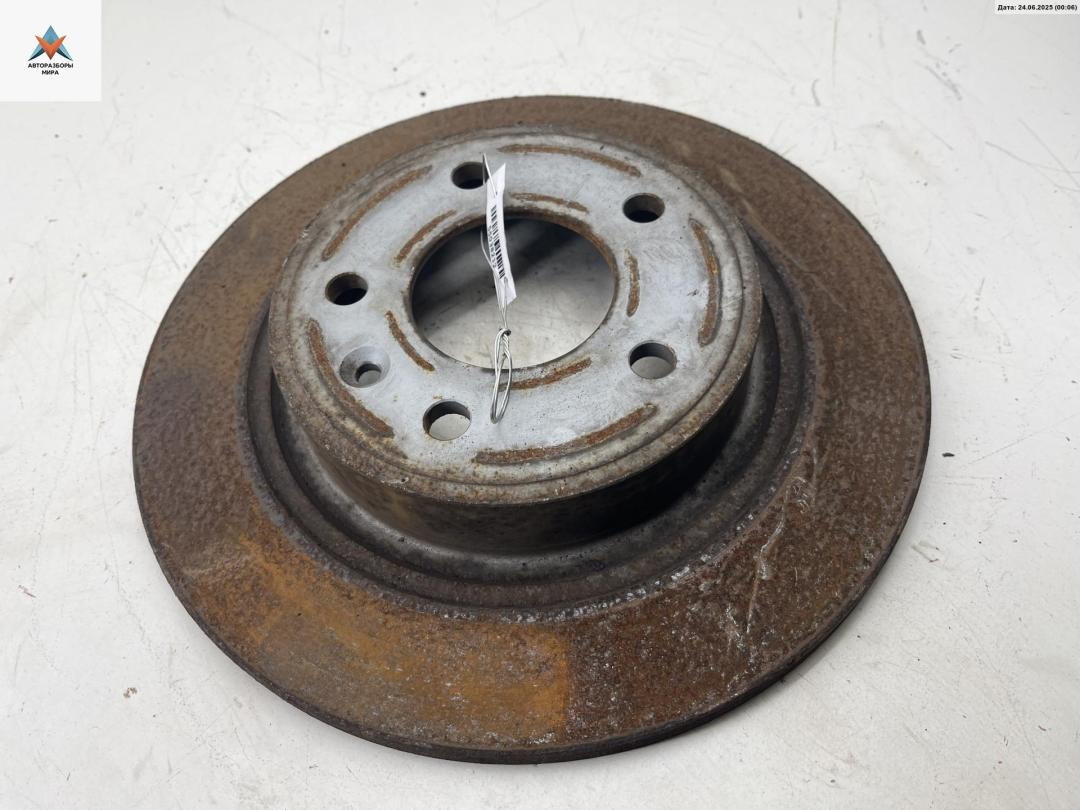 диск тормозной задний Chevrolet Orlando 1 поколение 2011, 2.0 л., дизель, АКПП, чёрный, минивэн - фото №1