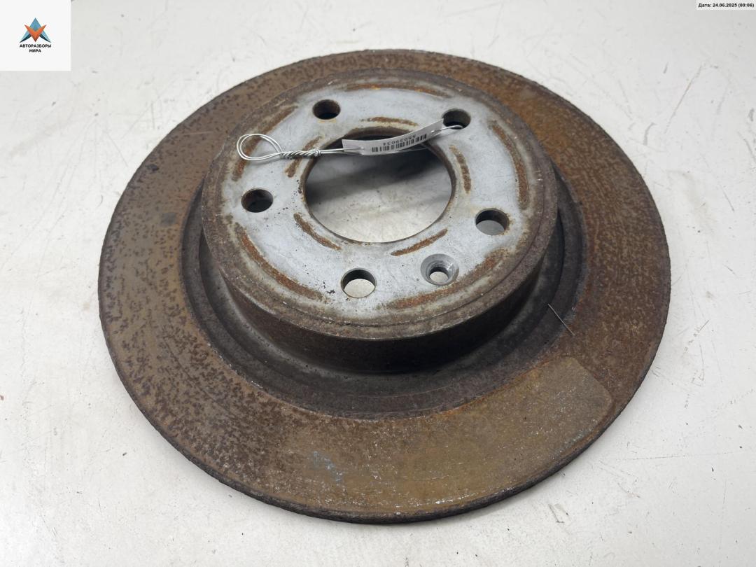 диск тормозной задний Chevrolet Orlando 1 поколение 2011, 2.0 л., дизель, АКПП, чёрный, минивэн - фото №1