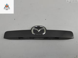 накладка подсветки номера Mazda CX-7 1 поколение 2007, 2.3 л., бензин, МКПП, серый, внедорожник 5 дв., EG2150811