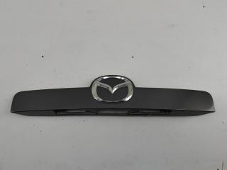 накладка подсветки номера Mazda CX-7 1 поколение 2007, 2.3 л., бензин, МКПП, серый, внедорожник 5 дв., EG2150811