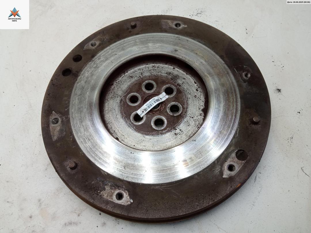 маховик Mitsubishi L300 2 поколение 1989, 2.5 л., дизель, МКПП, белый, микроавтобус - фото №1