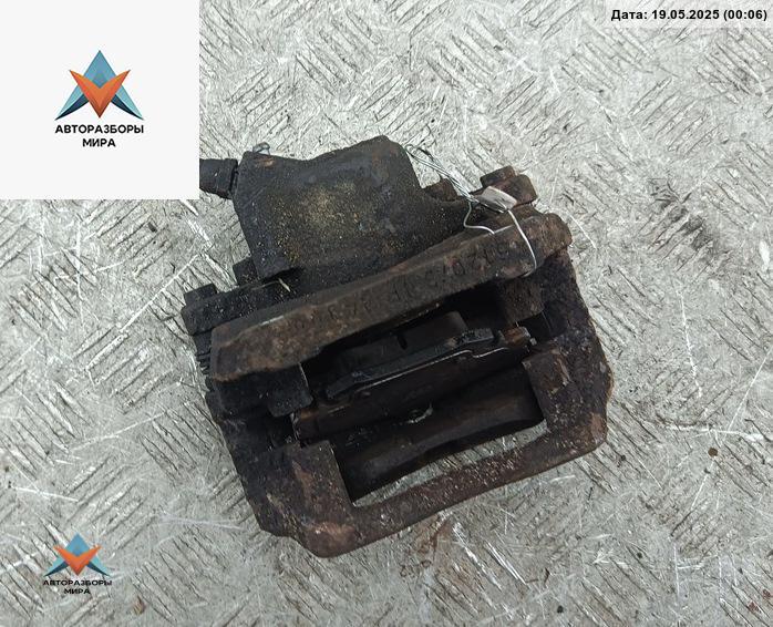 суппорт передний левый Dacia (Renault) Sandero I 2009, 1.2 л., бензин, МКПП, красный, хетчбэк 5 дв. - фото №1