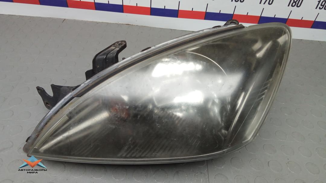 фара левая Mitsubishi Lancer 9 поколение 2006, 2.0 л., бензин, МКПП, универсал - фото №1