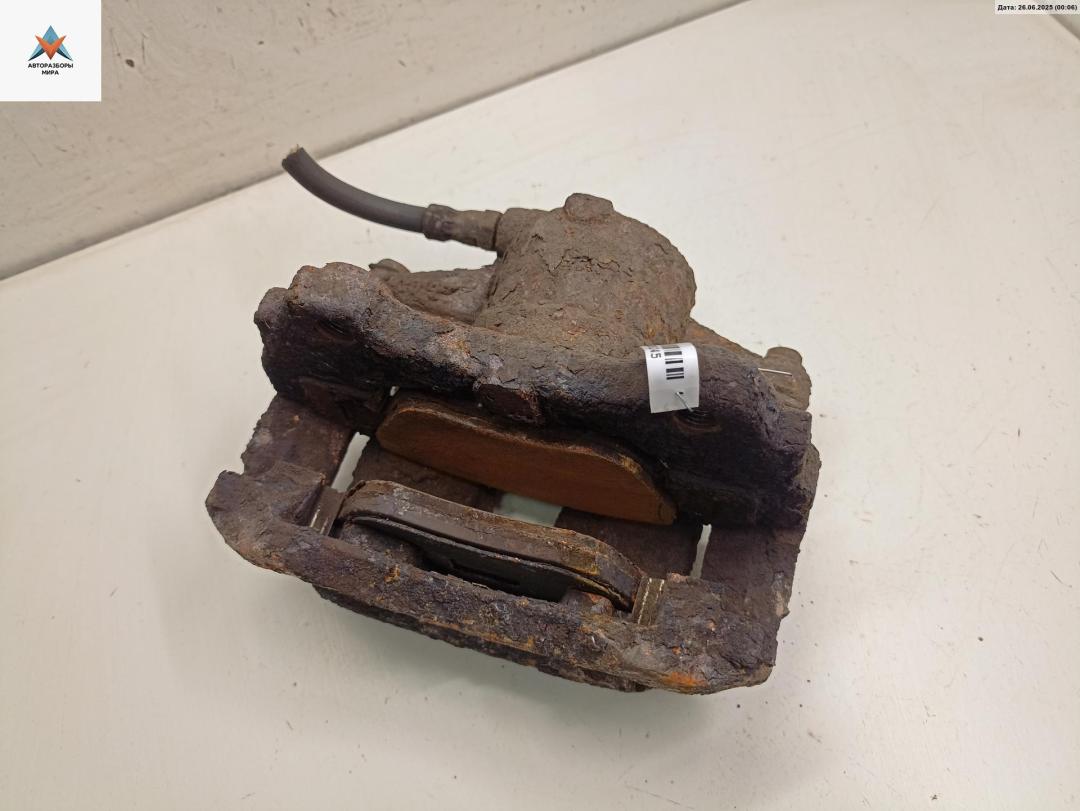 суппорт передний левый Opel Corsa D 2006, 1.0 л., бензин, МКПП, белый, хетчбэк 3 дв. - фото №1