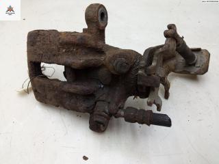 суппорт задний левый Nissan Almera N16 [рестайлинг] 2002, 1.8 л., бензин, МКПП, серый, хетчбэк 3 дв.