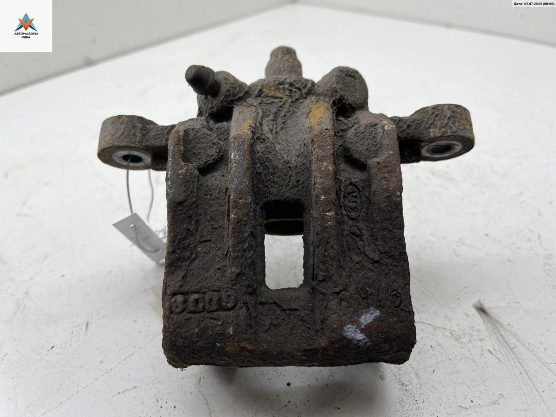 суппорт задний левый Kia Rio 2 поколение 2006, 1.4 л., бензин, МКПП, синий, хетчбэк 5 дв. - фото №1