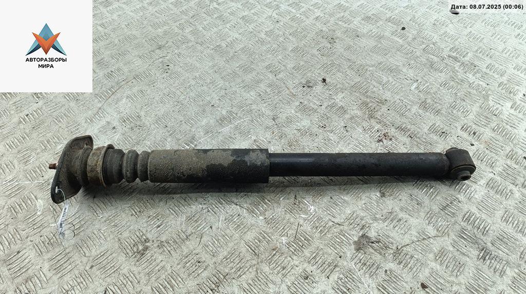 амортизатор задний левый Kia Rio 2 поколение 2006, 1.4 л., бензин, МКПП, синий, хетчбэк 5 дв., 55310-1G210 - фото №1