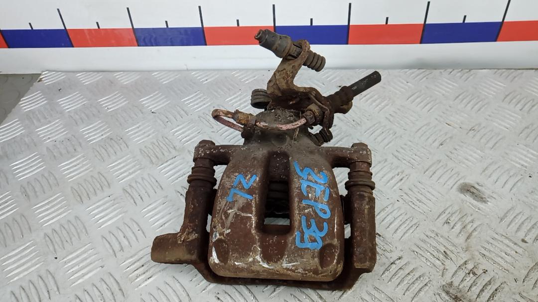 суппорт задний левый Volkswagen Touran 1 поколение 2005, 1.9 л., дизель, МКПП, минивэн, 1K0615423M - фото №1