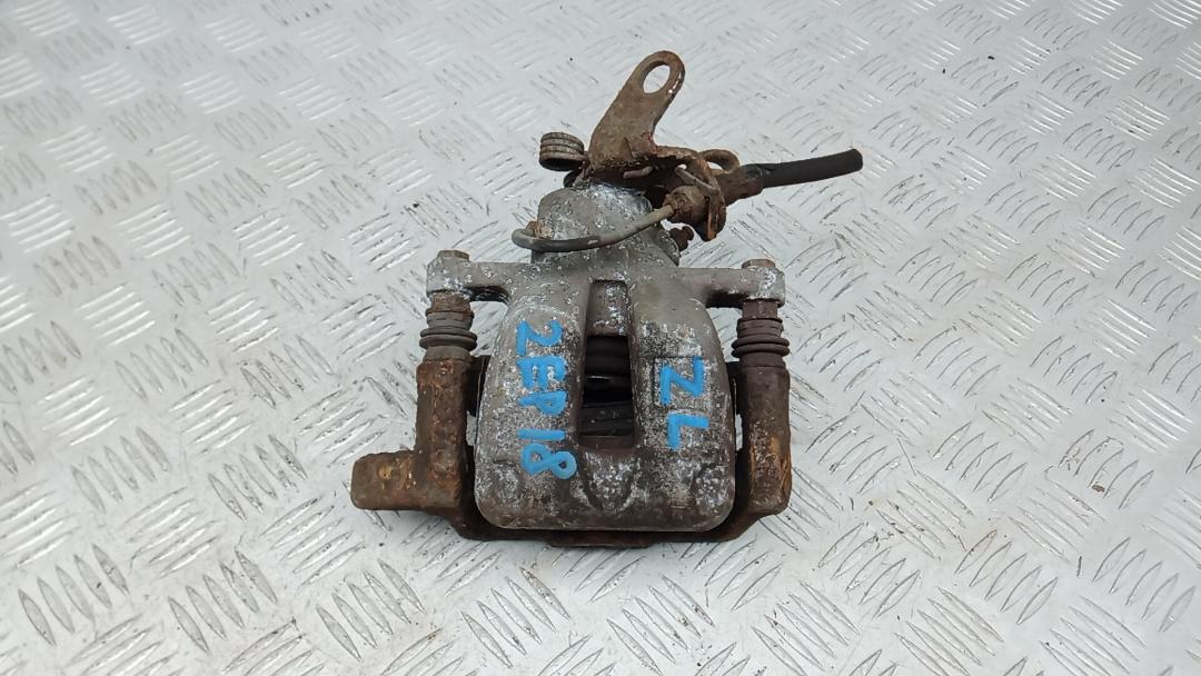 суппорт задний левый Volkswagen Touran 1 поколение 2005, 1.9 л., дизель, МКПП, минивэн, 1K0615423M - фото №1