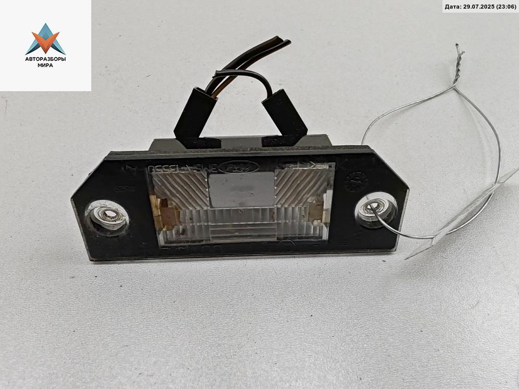 подсветка номера Ford Focus 2 поколение 2005, 1.6 л., i, бензин, МКПП, серый, хетчбэк 5 дв., 3M5A13550A - фото №1